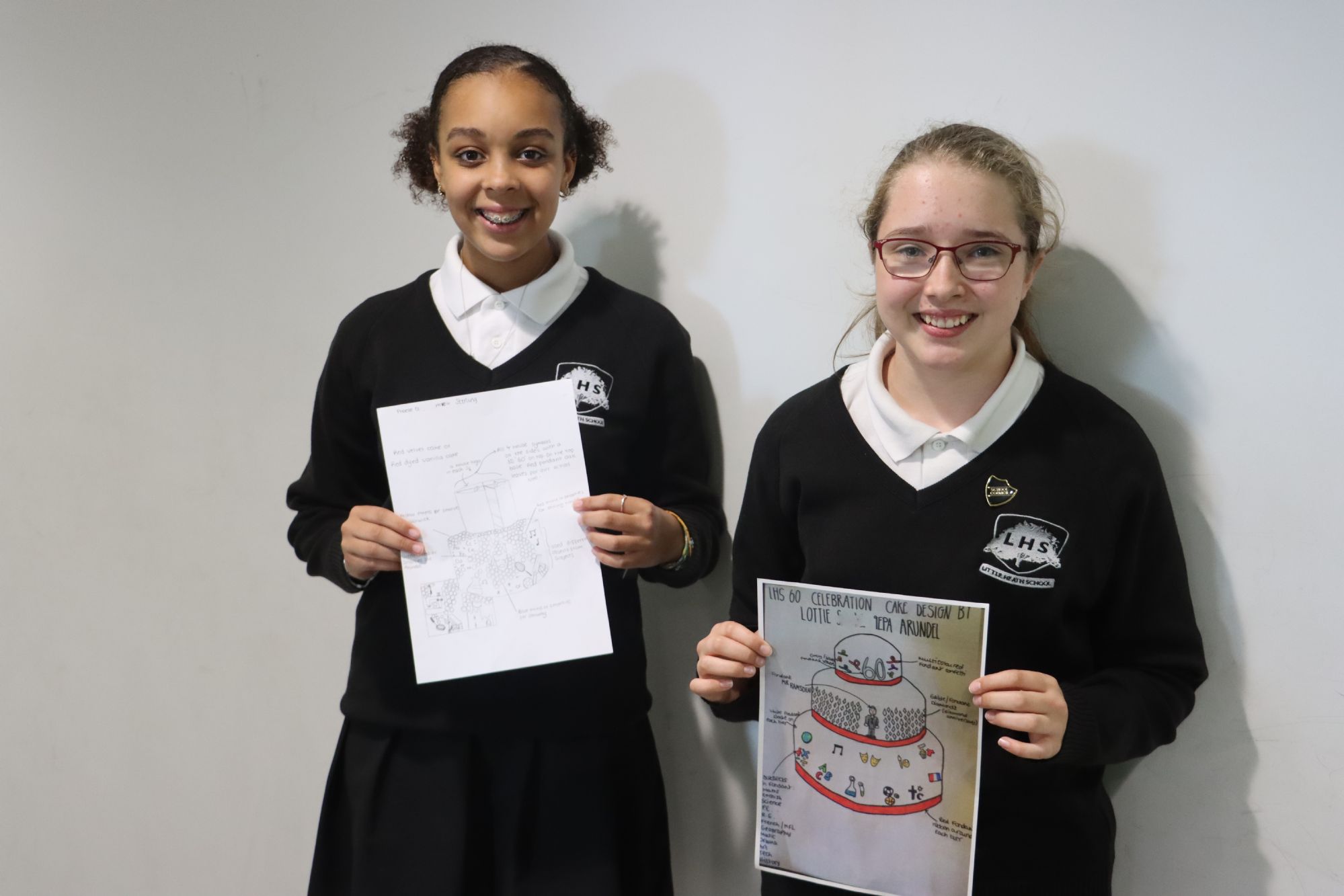 Phoebe and Lottie with their winning cake designs