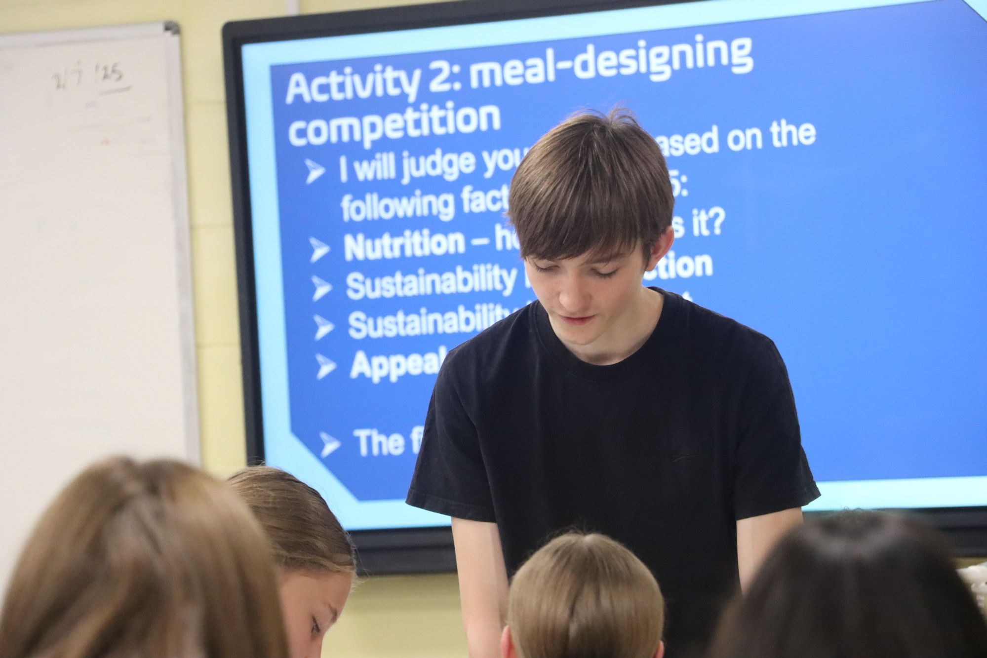 Year 12 Sustainability Prefect, Logan, helps out