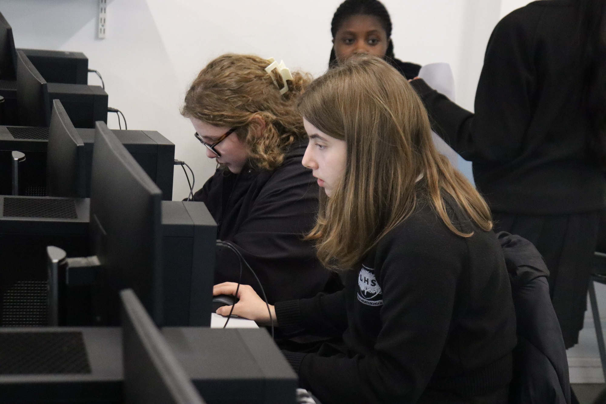 The team researching products on the computers