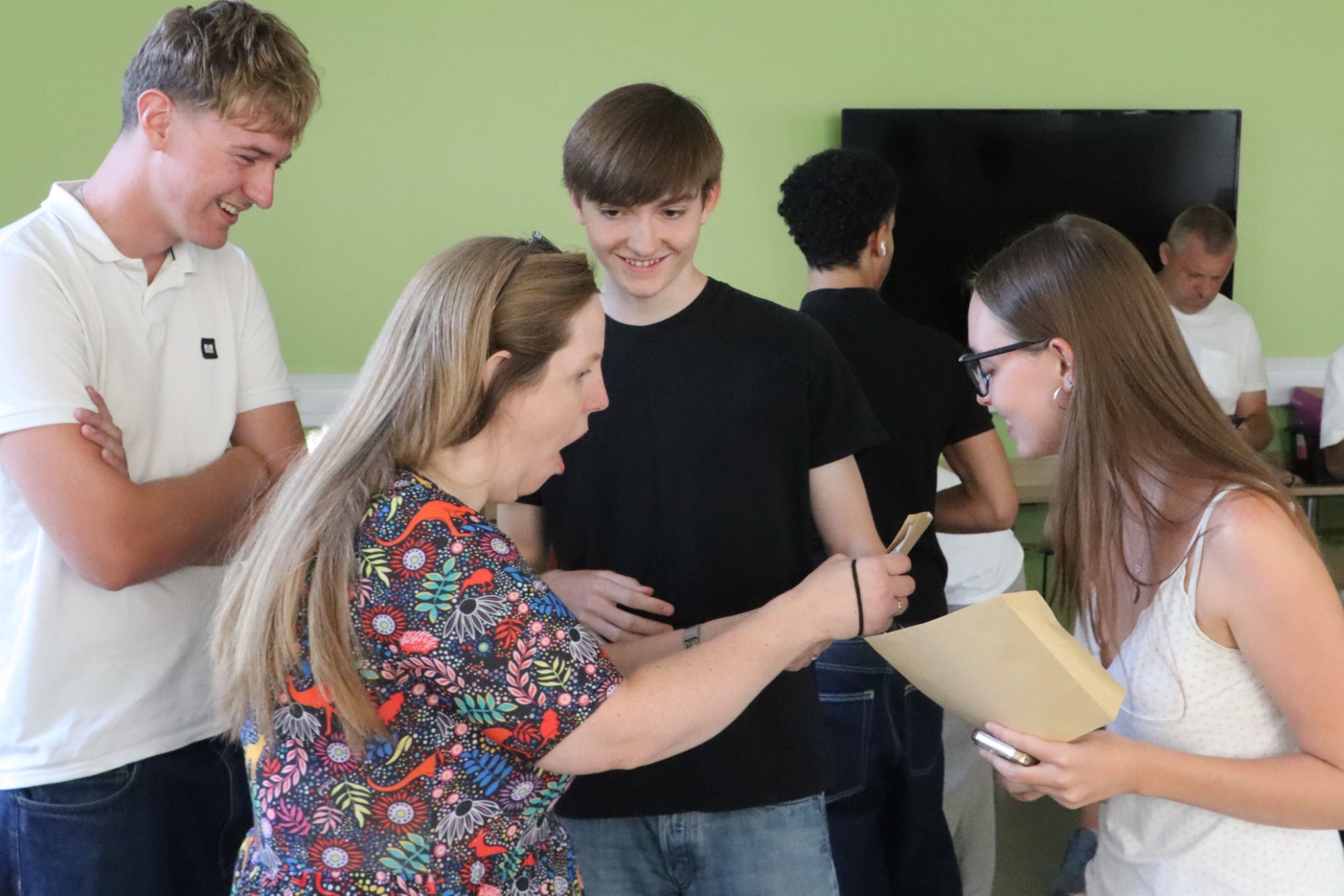 Staff celebrate student result success