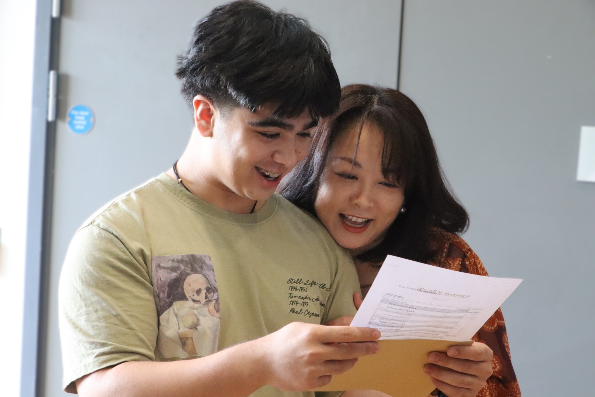 GCSE Student celebrates with family