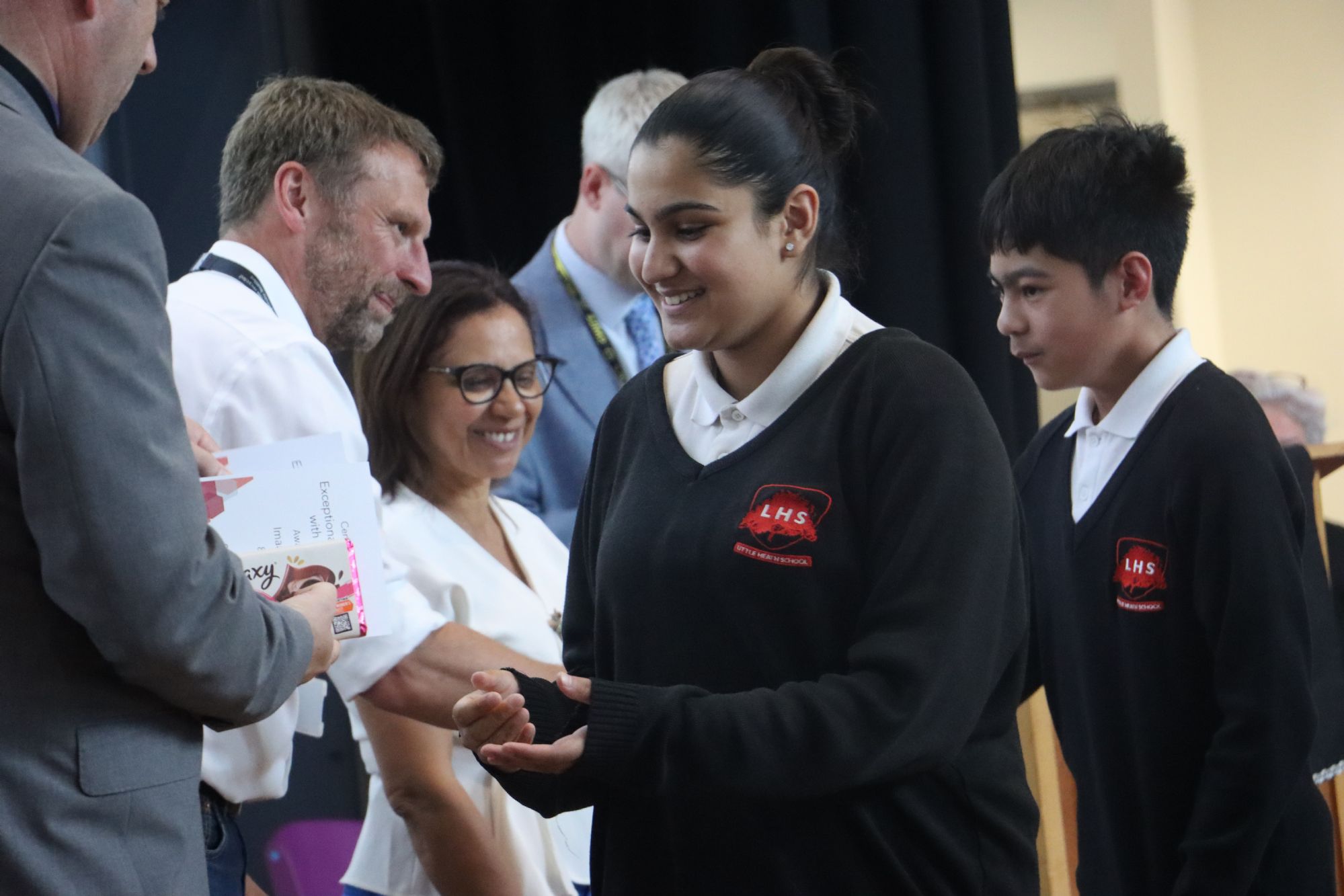 Year 8 Graduation - student receives their prize Year 8 Graduation - student receives their prize