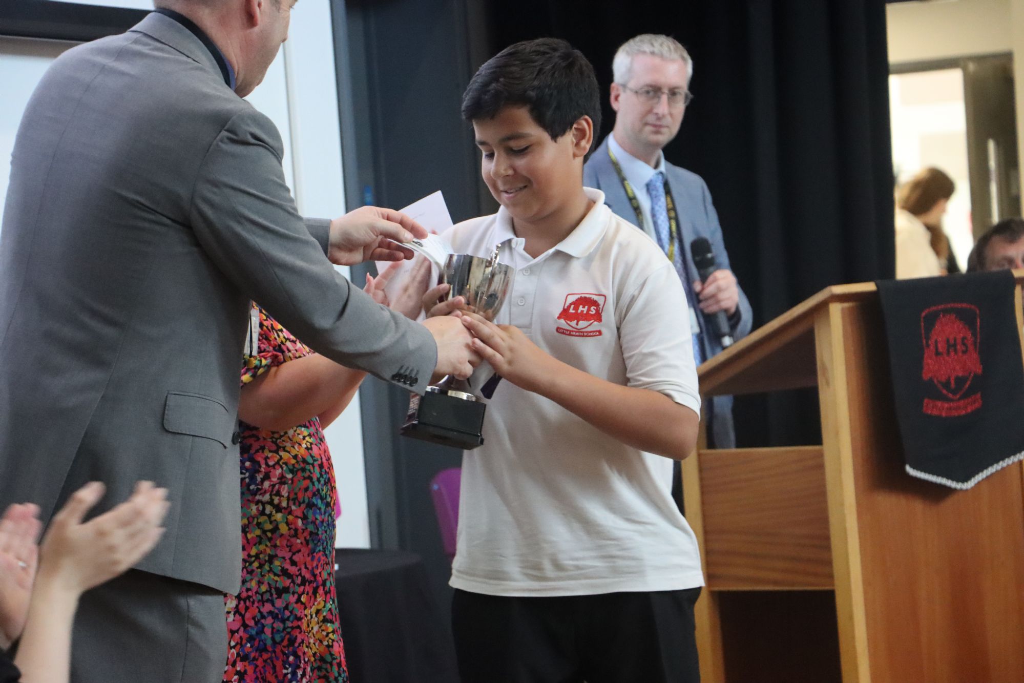Year 8 Graduation - student receives their prize Year 8 Graduation - student receives their prize