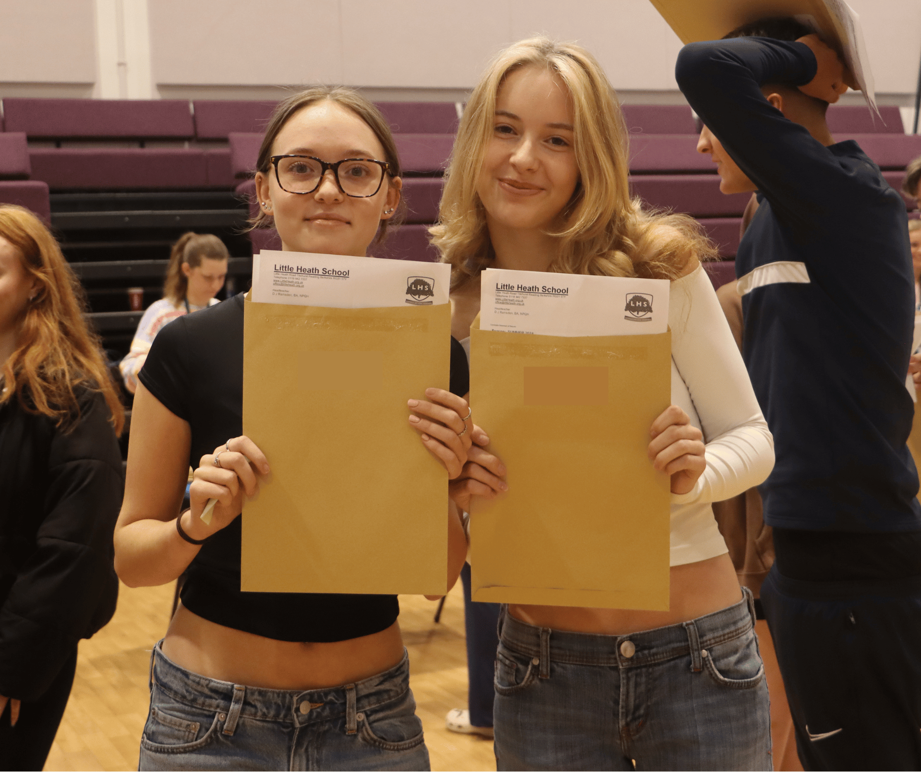 Students posing with their results envelopes