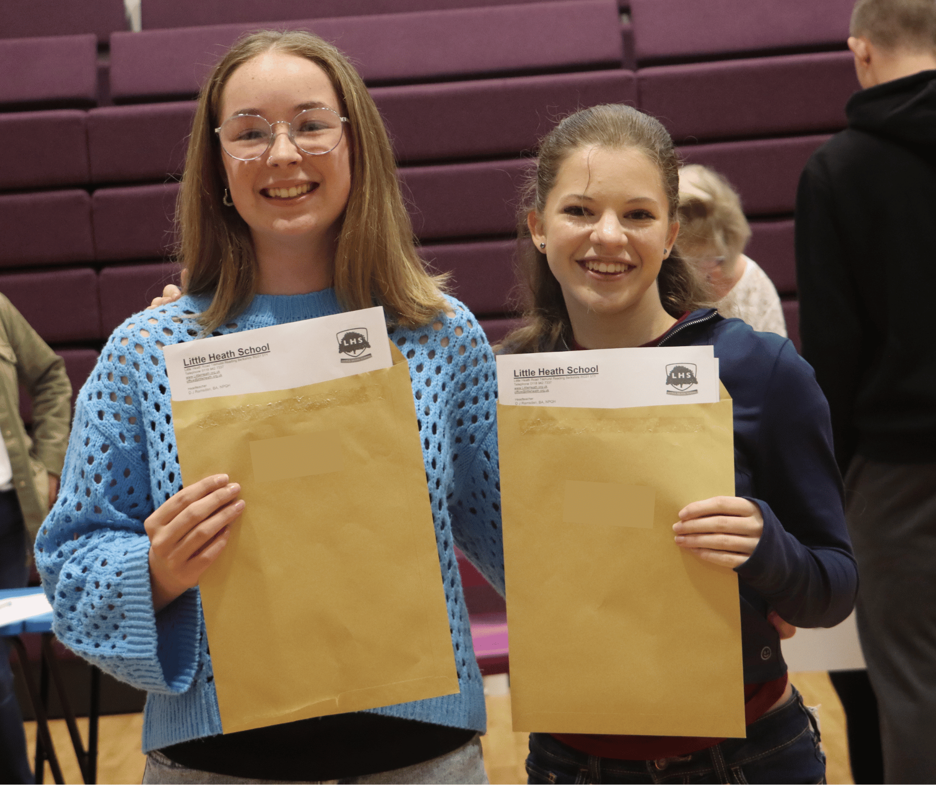 Students posing with their results envelopes