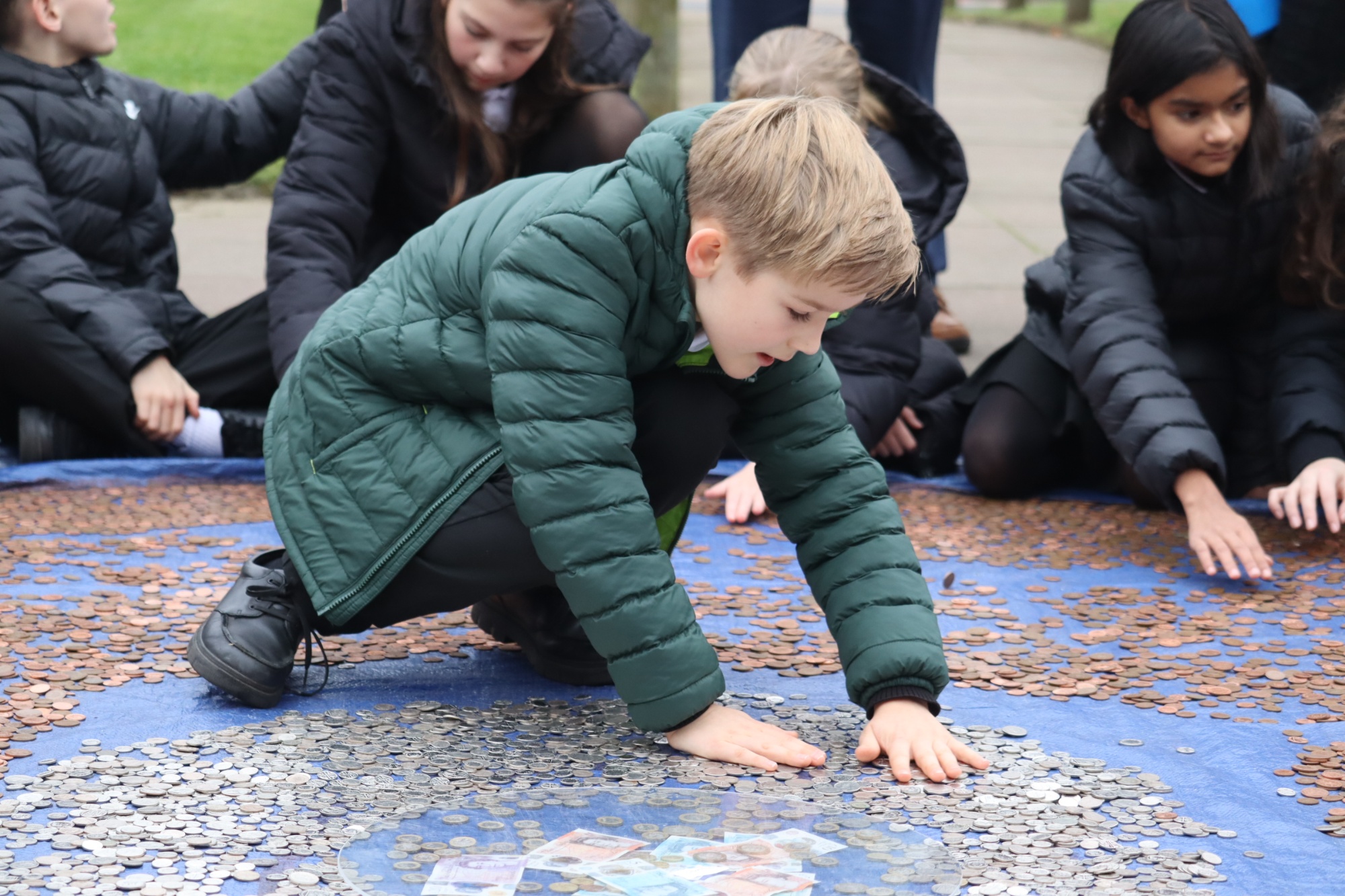 Year 7 student laying coins Year 7 student laying coins