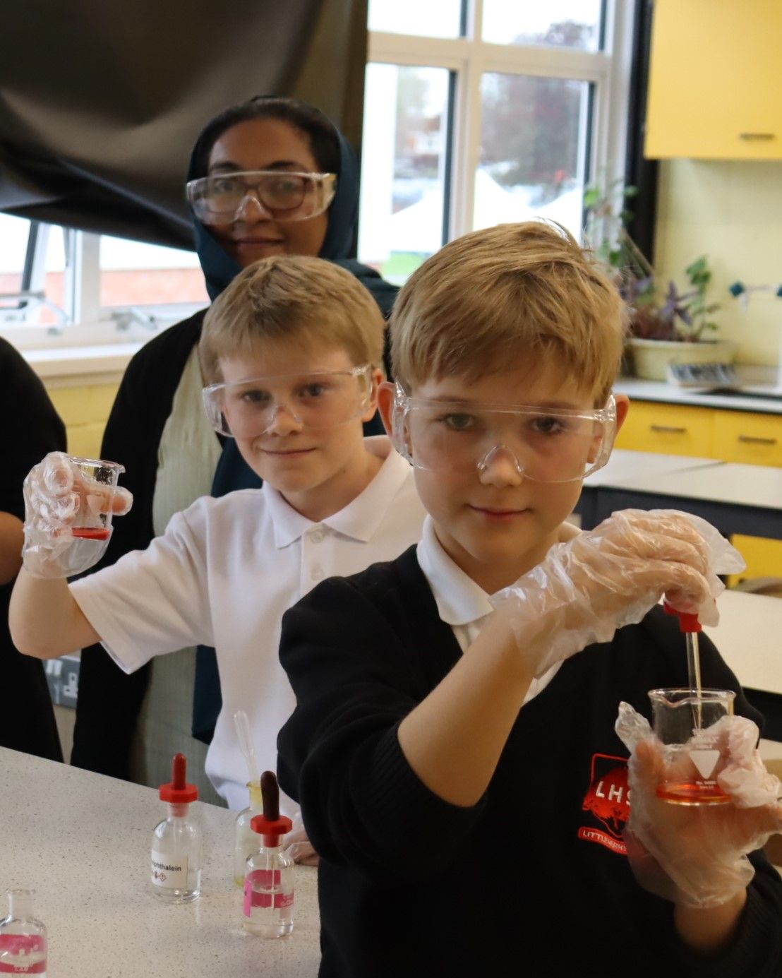 Year 7 students at Science Club with Mrs Nazar