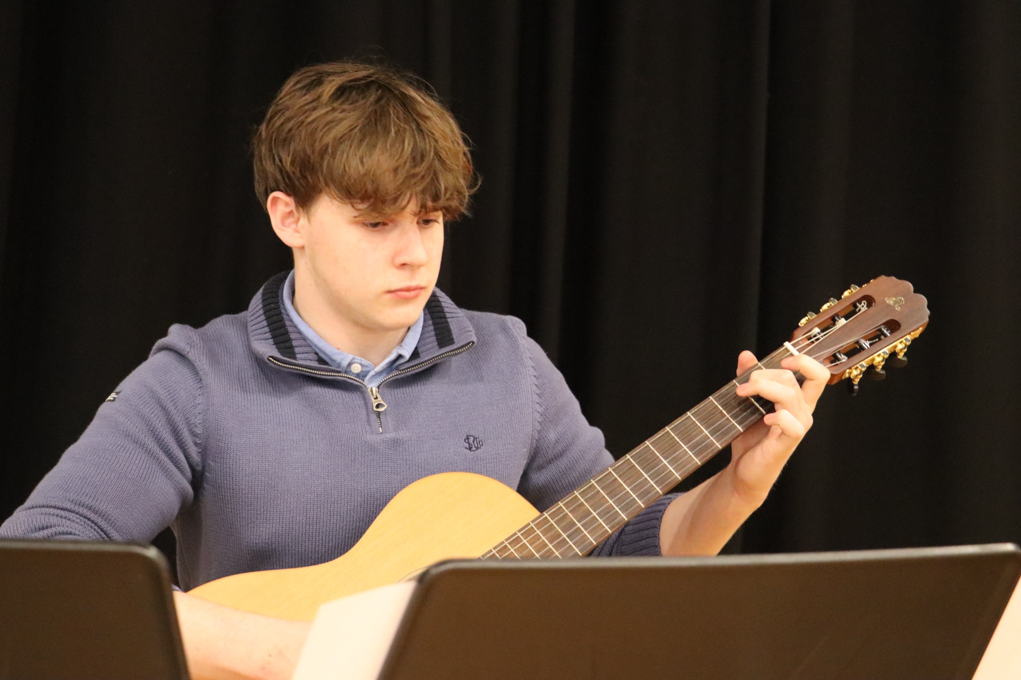 A level musician performs on guitar A level musician performs on guitar