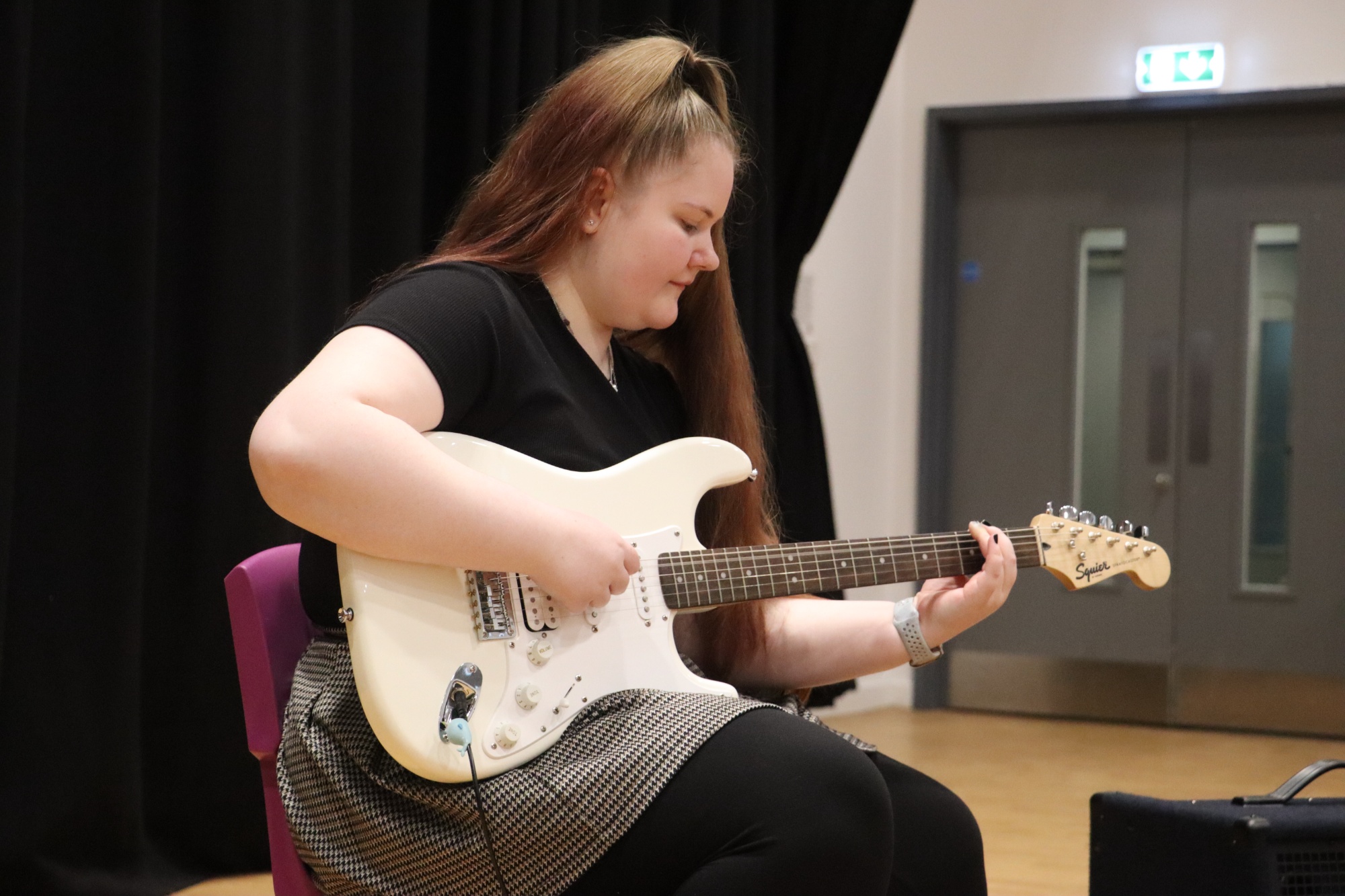 A level musician performs on guitar A level musician performs on guitar