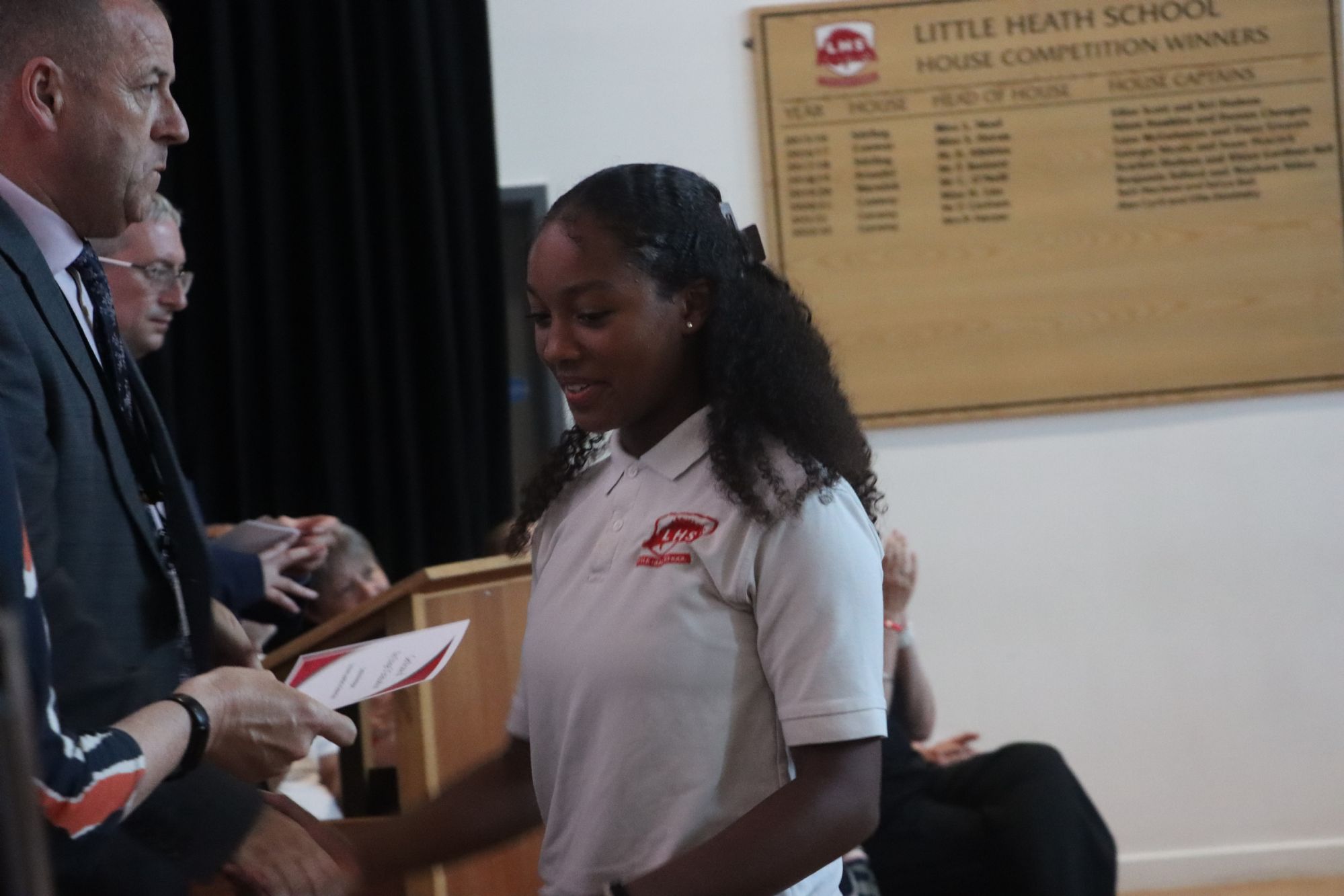 Year 8 student collecting their certificate Year 8 student collecting their certificate