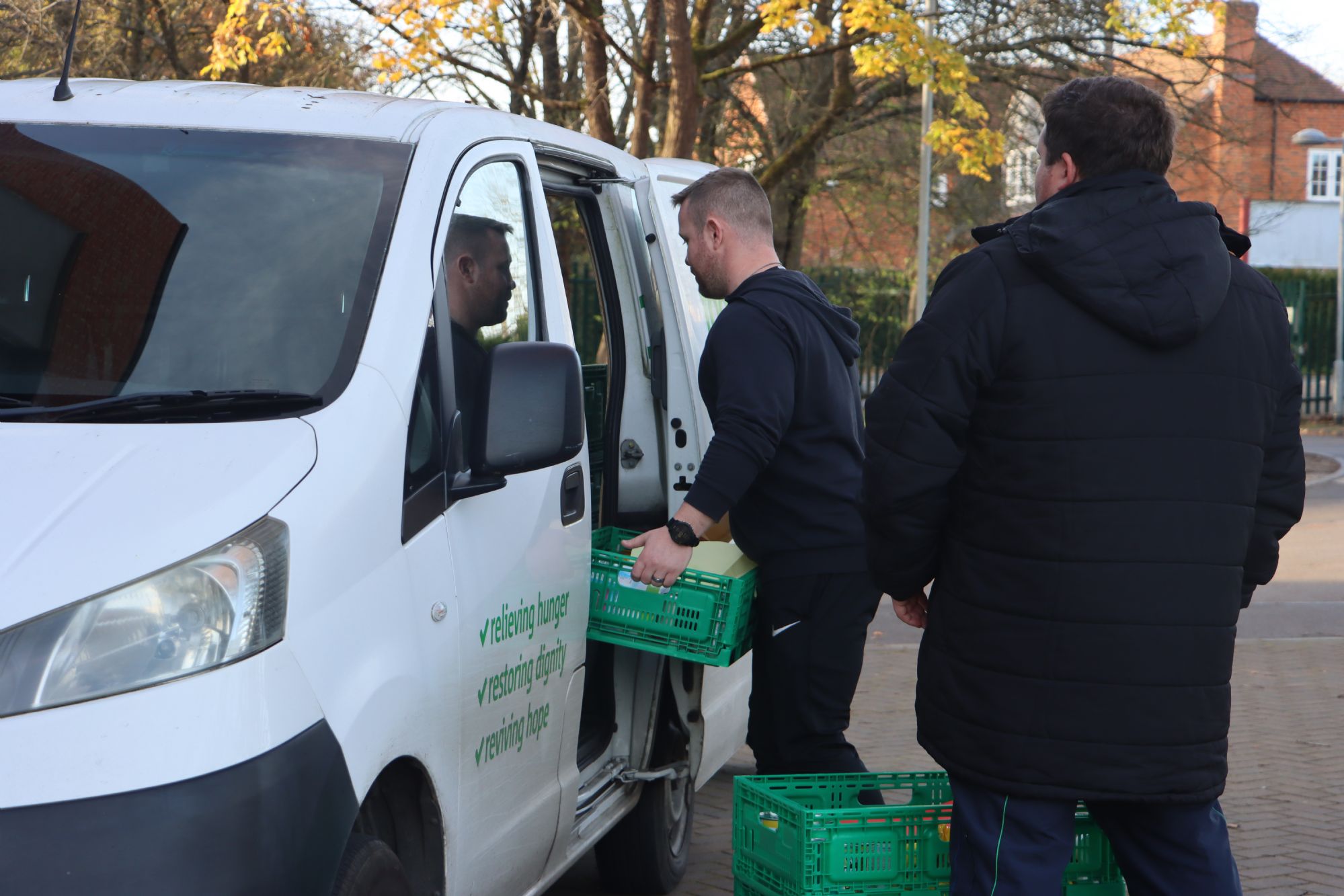 Heads of House loading the van with donations Heads of House loading the van with donations
