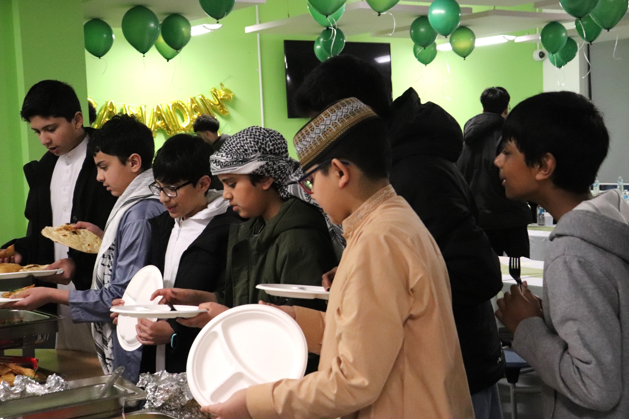 Students in line for their Iftar meal Students in line for their Iftar meal