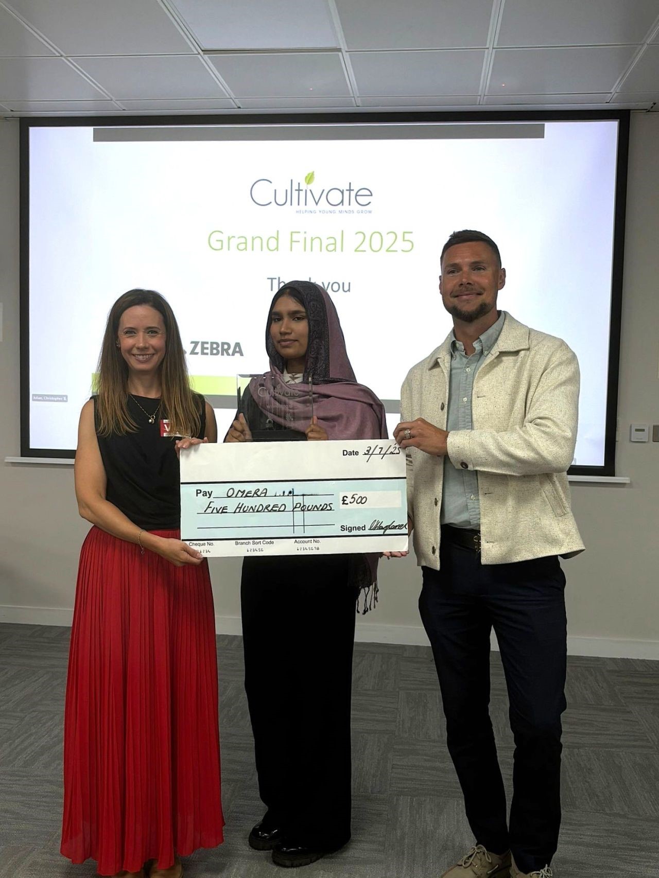 Winner, Omera, with her £500 cheque Winner, Omera, with her £500 cheque